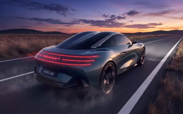 Peugeot RCZ Vision electric sports car concept driving on a highway at sunset, 5K Ultra HD desktop wallpaper background.