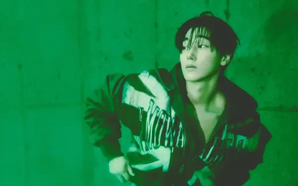 ATEEZ’s San in a moody green Golden Hour portrait, featured in a 5K Ultra HD PC desktop wallpaper and background.