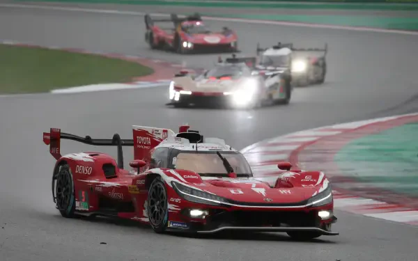 Toyota TR010 Hybrid race cars speed around a circuit in the FIA World Endurance Championship, featured in a 5K Ultra HD desktop wallpaper.