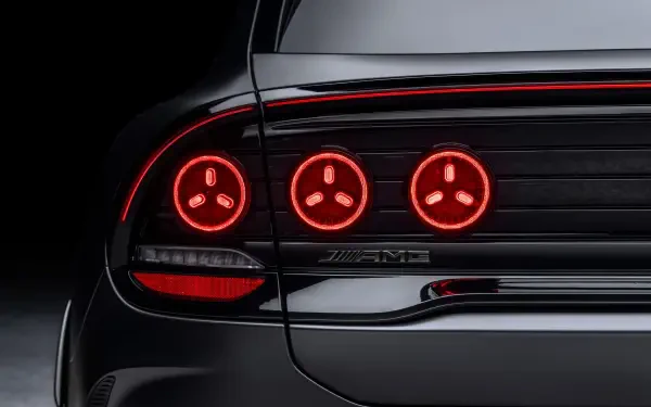 Close-up of the Mercedes-AMG GT SUV’s glowing red taillights, featured in a 2K Quad HD PC desktop wallpaper and background.