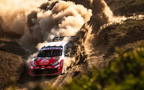 Toyota Gazoo Racing GR Yaris Rally1 charges through a dust cloud during WRC rally racing in this 4K Ultra HD desktop wallpaper.