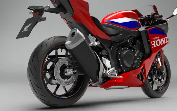 Red Honda CBR500R Four sport bike in a studio, featured in a 4K Ultra HD desktop wallpaper.