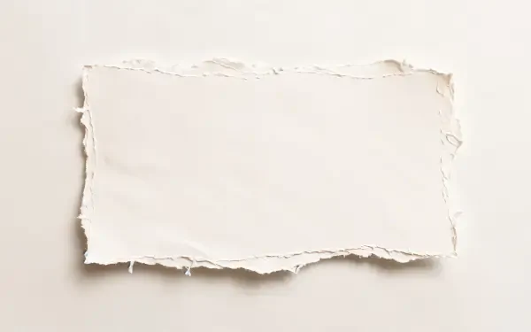 Clean blank white torn paper on a soft beige background, 4K Ultra HD PC desktop wallpaper.