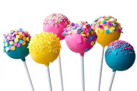 HD wallpaper featuring colorful candy cake pops on sticks, decorated with sprinkles in a bright and cheerful arrangement.