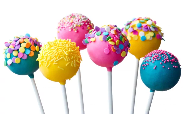 HD wallpaper featuring colorful candy cake pops on sticks, decorated with sprinkles in a bright and cheerful arrangement.