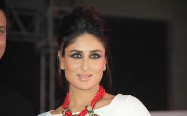 HD desktop wallpaper featuring celebrity Kareena Kapoor, showcasing her in a white outfit with bold eye makeup and a striking red necklace.
