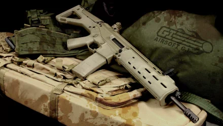 HD desktop wallpaper featuring a man-made assault rifle displayed on tactical gear with an airsoft logo visible in the background.