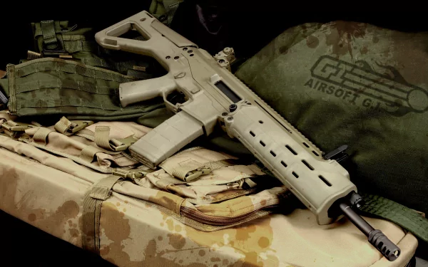 HD desktop wallpaper featuring a man-made assault rifle displayed on tactical gear with an airsoft logo visible in the background.
