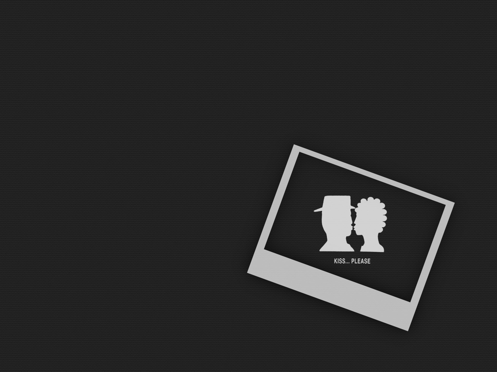 An artistic HD desktop wallpaper featuring a playful silhouette of two figures sharing a kiss, symbolizing love, set against a sleek black background.