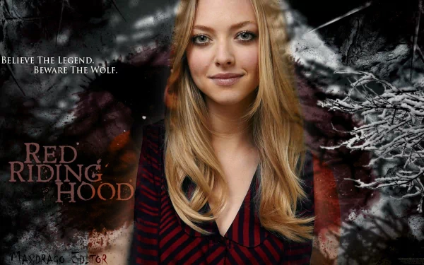 HD PC desktop wallpaper of a blonde celebrity actress smiling against a snowy, dark Red Riding Hood–themed background.