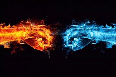 An HD desktop wallpaper depicting two fiery fists, one engulfed in orange flames and the other in blue flames, clashing in the center, creating a striking and abstract visual against a black background.
