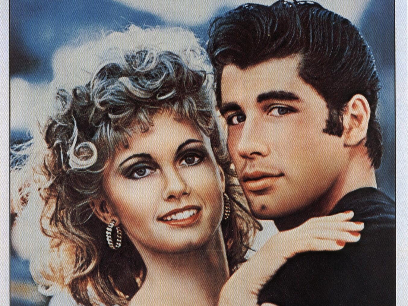 HD PC desktop wallpaper featuring iconic characters from the movie Grease, showcasing their classic 1950s style and close-up portrait.