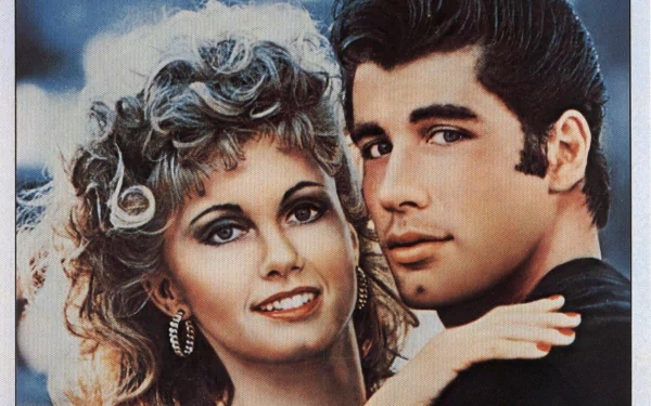 HD PC desktop wallpaper featuring iconic characters from the movie Grease, showcasing their classic 1950s style and close-up portrait.