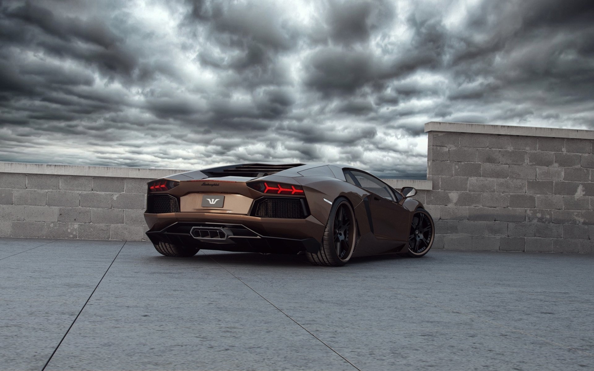 A sleek black Lamborghini Aventador LP 700-4 parked on a rooftop under dramatic cloudy skies, captured in HD for a striking PC desktop wallpaper.