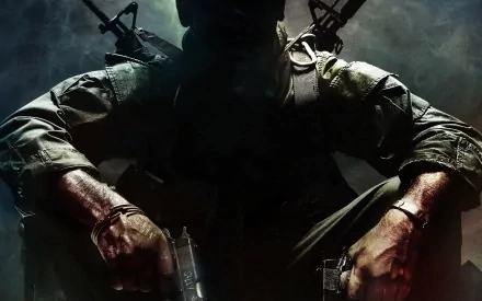 HD desktop wallpaper featuring a mysterious soldier from Call Of Duty: Black Ops, holding weapons and set against a dark, atmospheric background.