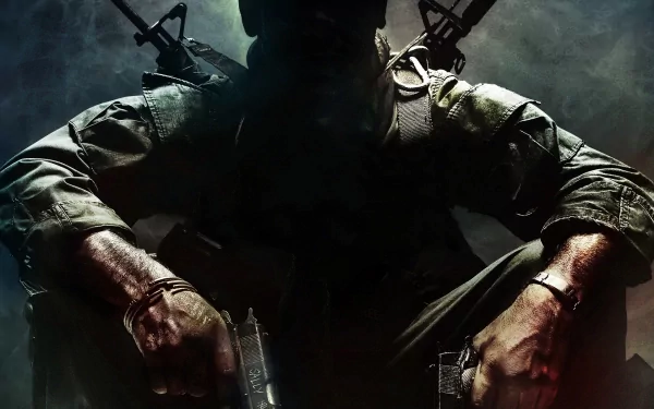 HD desktop wallpaper featuring a mysterious soldier from Call Of Duty: Black Ops, holding weapons and set against a dark, atmospheric background.