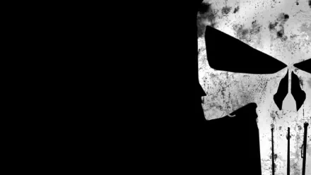 HD wallpaper featuring a bold Punisher skull design on a dark background, capturing the iconic comic character's fierce and gritty essence.