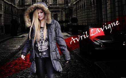HD desktop wallpaper featuring Avril Lavigne. She is walking down a cobblestone street, wearing a fur-hooded jacket, with her name prominently displayed in red text.