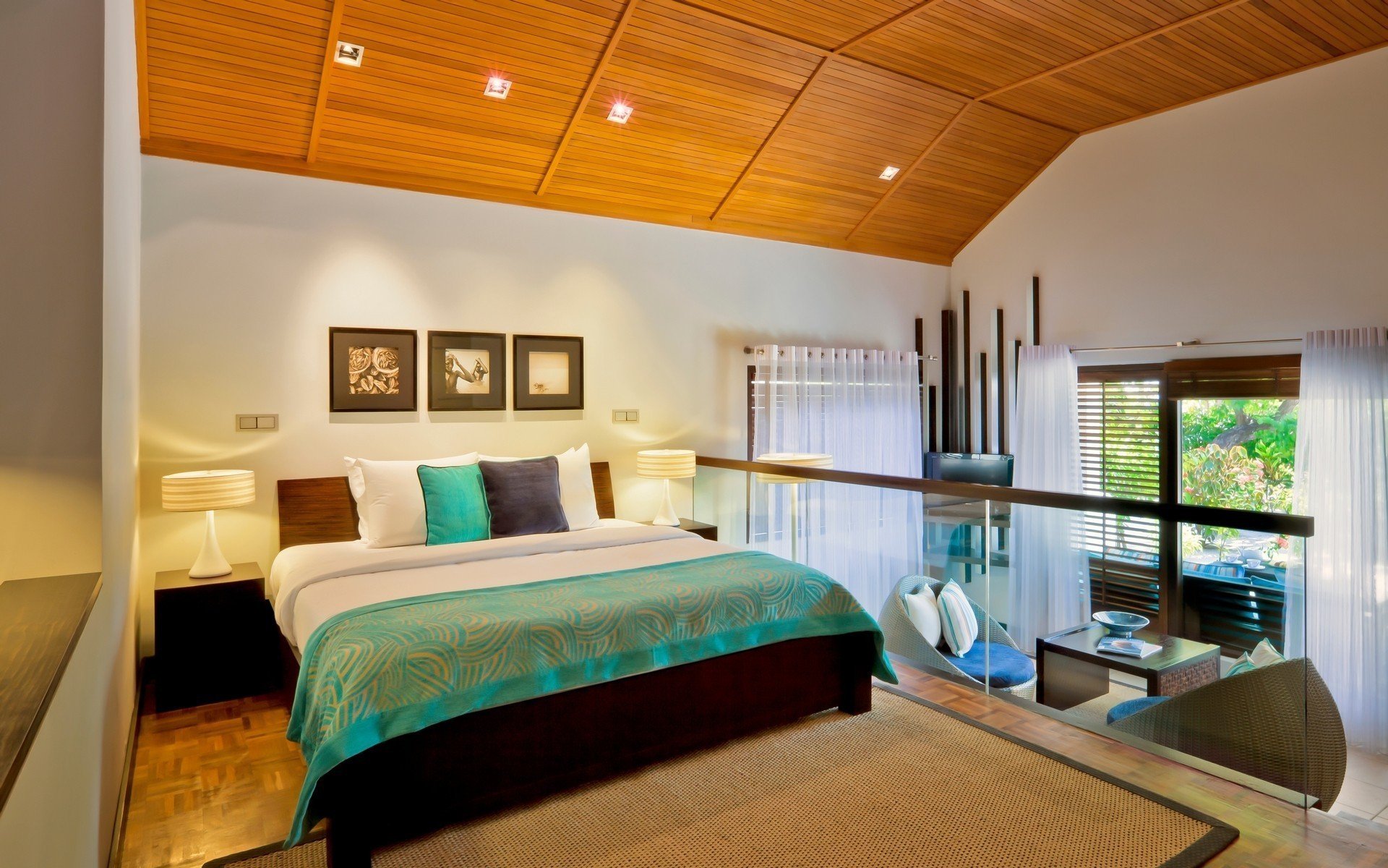 HD desktop wallpaper depicting a modern, man-made bedroom with wooden ceiling, large bed, stylish decor, and natural light streaming through windows.