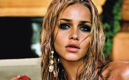 HD desktop wallpaper featuring a close-up of a woman with wet hair and striking eyes, showcasing Ana Beatriz Barros in a natural, sunlit setting.