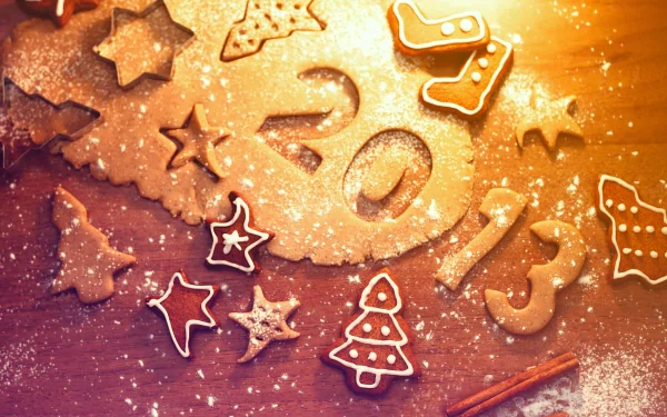 HD desktop wallpaper featuring Christmas and New Year 2013 themed cookies shaped like stars, trees, and candy canes on a warm, festive background.
