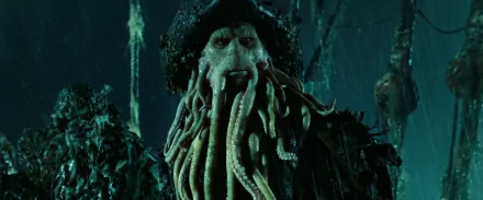 Davy Jones from Pirates of the Caribbean: Dead Man's Chest appears in this HD PC desktop wallpaper, showcasing his iconic tentacle beard in a dark, eerie setting.