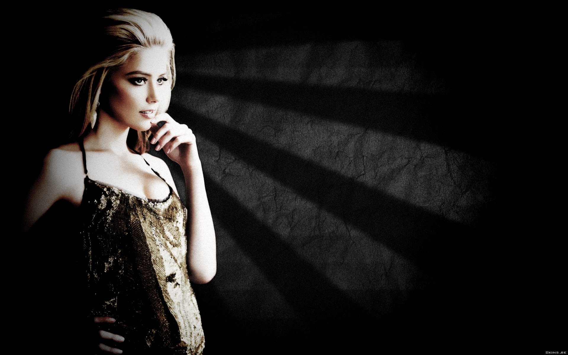 HD PC desktop wallpaper featuring celebrity Amber Heard in a stylish outfit against a dark, textured background with dramatic lighting.