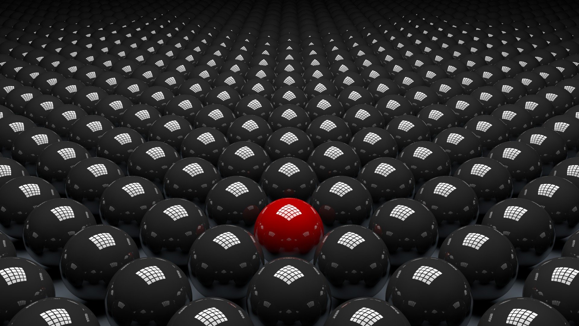 A striking abstract CGI design featuring a sea of grey spheres with a prominent red ball at the center, creating a bold visual contrast in a 3D wallpaper background.