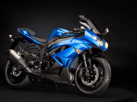 HD wallpaper featuring a blue Kawasaki Ninja motorcycle on a black background.