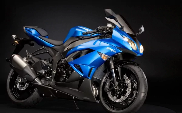 HD wallpaper featuring a blue Kawasaki Ninja motorcycle on a black background.
