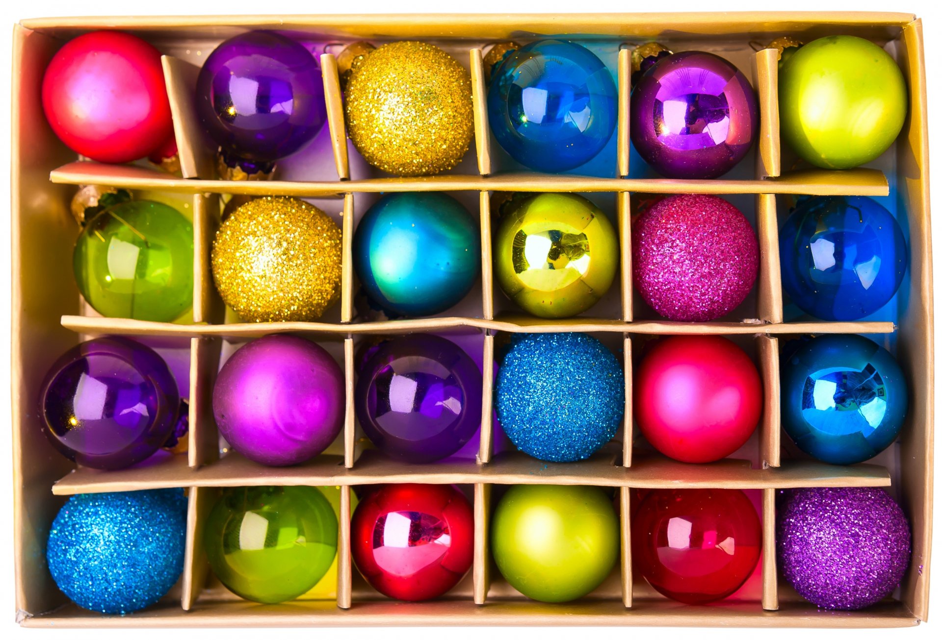 A vibrant assortment of Christmas ornaments in various colors and textures, arranged neatly in a box, capturing the festive spirit of the holiday season. 4K Ultra HD quality.