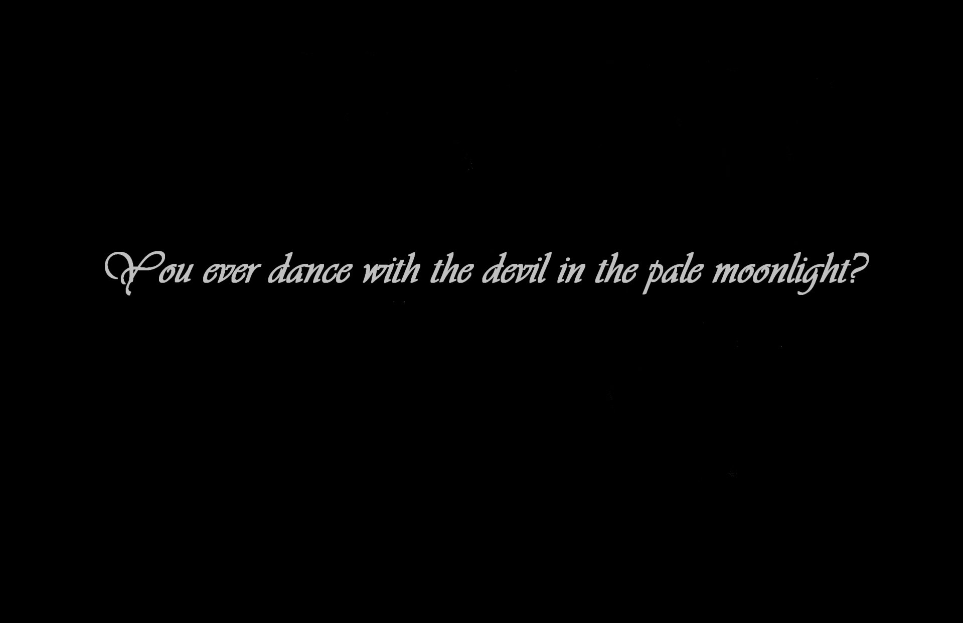 HD PC desktop wallpaper featuring a dark background with the quote, You ever dance with the devil in the pale moonlight? from the Batman movie.