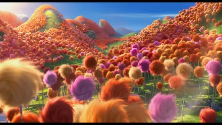 4K Ultra HD movie wallpaper of The Lorax featuring a vibrant landscape filled with colorful Truffula trees under a bright blue sky.
