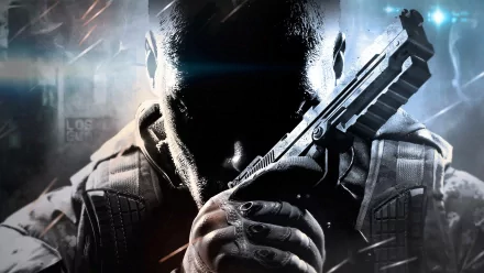 An HD desktop wallpaper featuring a character from Call of Duty: Black Ops II, poised with a handgun against a dramatic background, capturing the game's intense atmosphere.