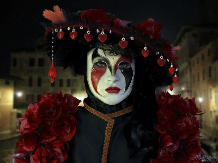 HD photography of a person wearing an ornate Venetian mask and elaborate costume with red roses and beads, set against a nighttime urban backdrop.