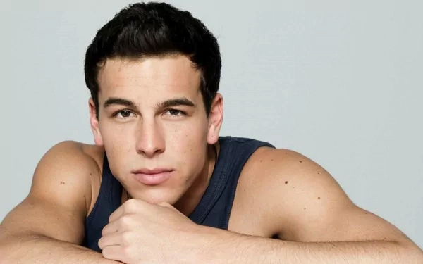 HD PC desktop wallpaper featuring a close-up portrait of celebrity Mario Casas with a neutral expression against a plain background.