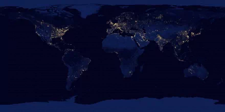 A detailed world map at night, showcasing illuminated cities across continents, presented as a high-definition desktop wallpaper and background.