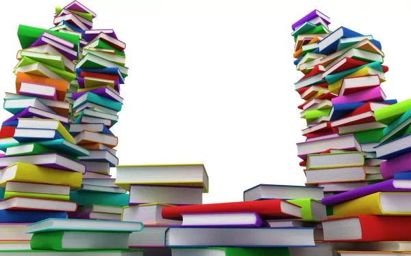 HD desktop wallpaper featuring large, colorful stacks of books against a white background, creating an eye-catching, man-made scene.