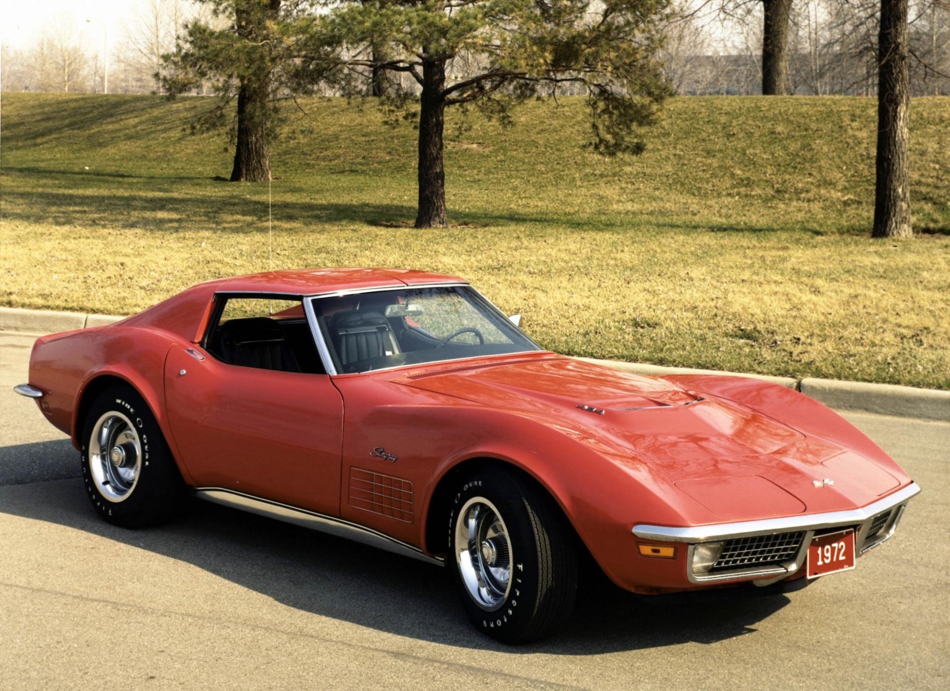 Red 1972 Chevrolet Corvette classic sports vehicle parked on a sunlit street — HD PC desktop wallpaper background.