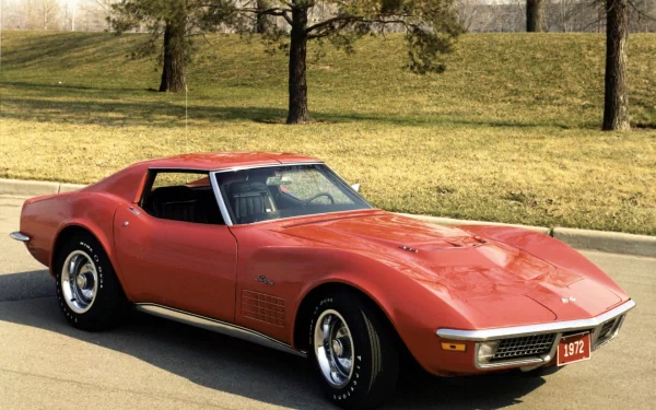 Red 1972 Chevrolet Corvette classic sports vehicle parked on a sunlit street — HD PC desktop wallpaper background.