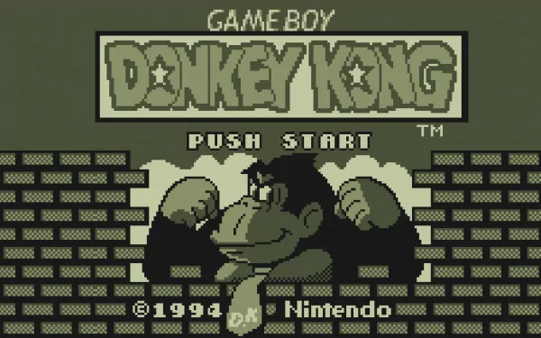 HD PC desktop wallpaper: retro Game Boy video game Donkey Kong title screen — pixel art Donkey Kong, Push Start prompt, Nintendo logo and brick background in classic green monochrome.