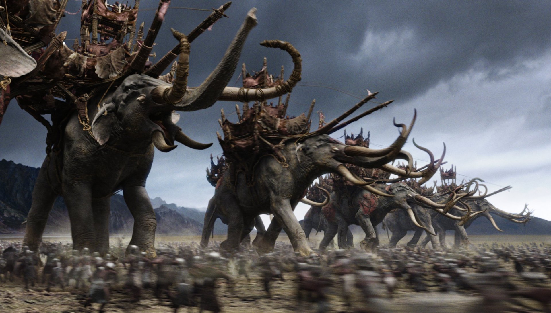 HD PC desktop wallpaper featuring a battle scene with massive war elephants from the movie The Lord of the Rings: The Return of the King.