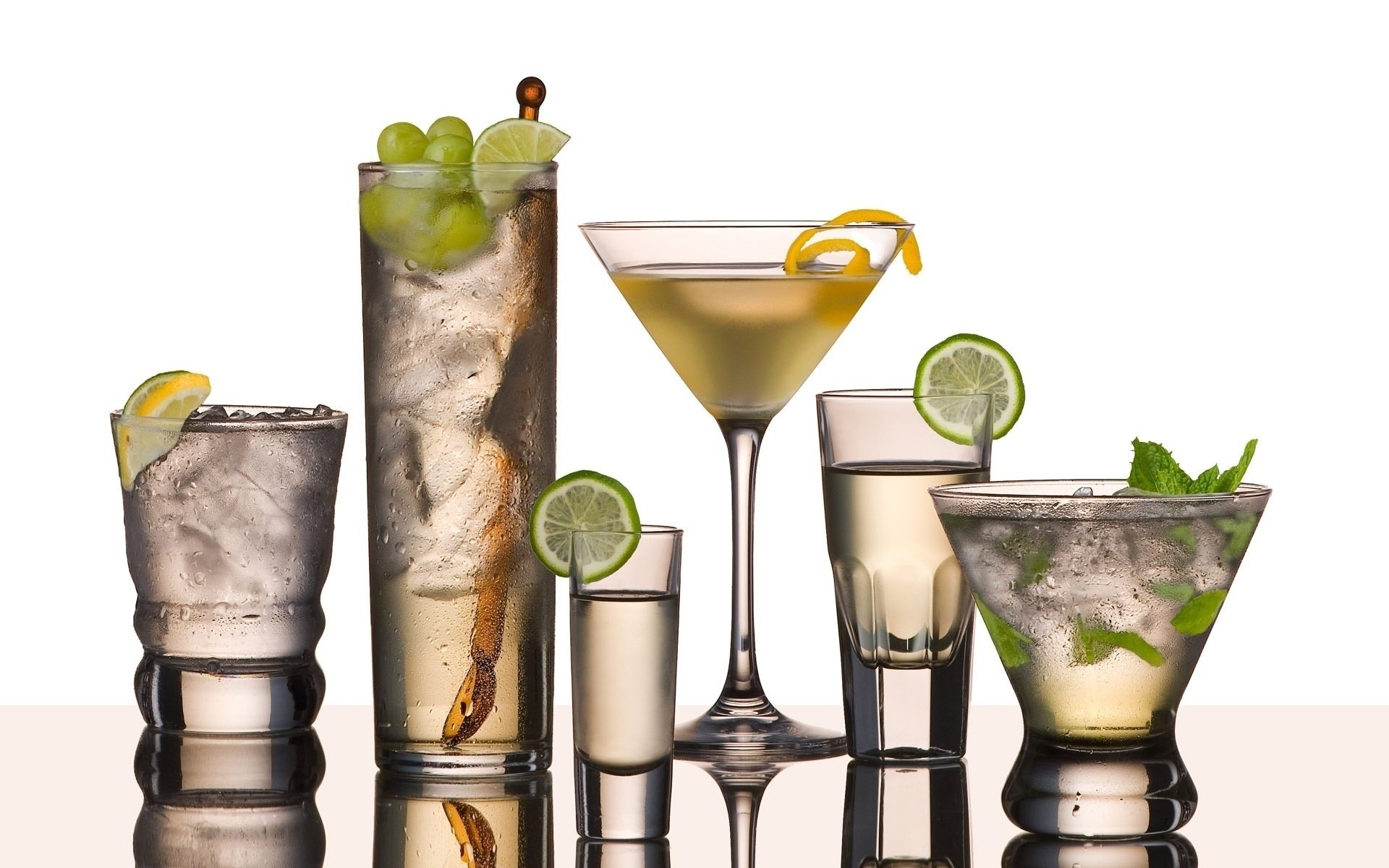 HD PC desktop wallpaper featuring an array of elegant cocktails and garnishes, showcasing clear glassware filled with vibrant mixed drinks against a white background.