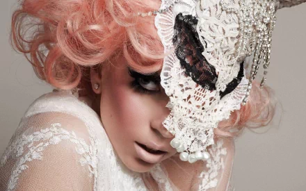 HD PC desktop wallpaper featuring Lady Gaga with pink hair and a detailed lace mask, capturing a striking music-inspired aesthetic.