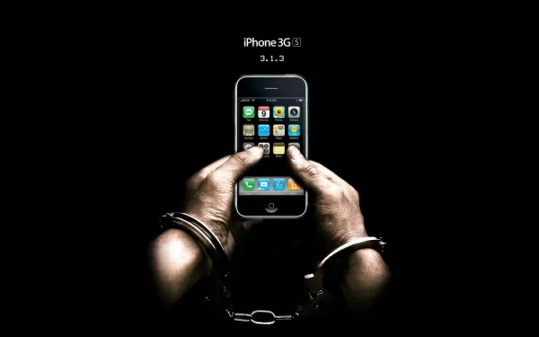A pair of hands in handcuffs holding an Apple iPhone 3G(S) against a black background, highlighting technology and control in an HD desktop wallpaper.