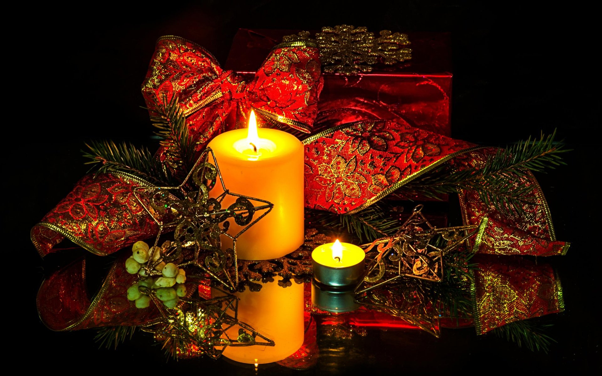 A cozy holiday scene featuring a glowing candle surrounded by festive Christmas ornaments, ribbons, and a red gift, creating a warm and inviting atmosphere.