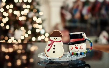 A festive scene featuring cute snowman cookies and an ornamented mug, set against a backdrop of twinkling lights and a Christmas tree, creating a joyful holiday atmosphere.