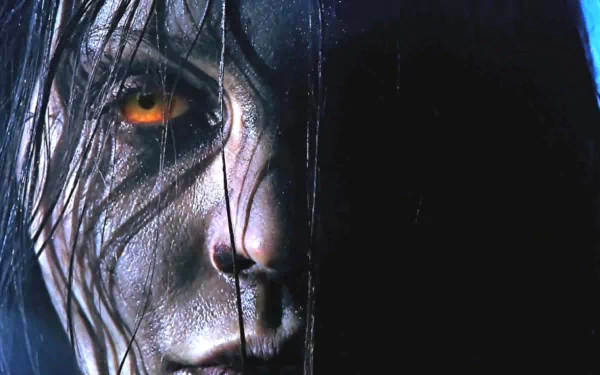 Close-up of a character’s intense face with glowing orange eye from the video game F.E.A.R. 3, featured as an HD PC desktop wallpaper and background.
