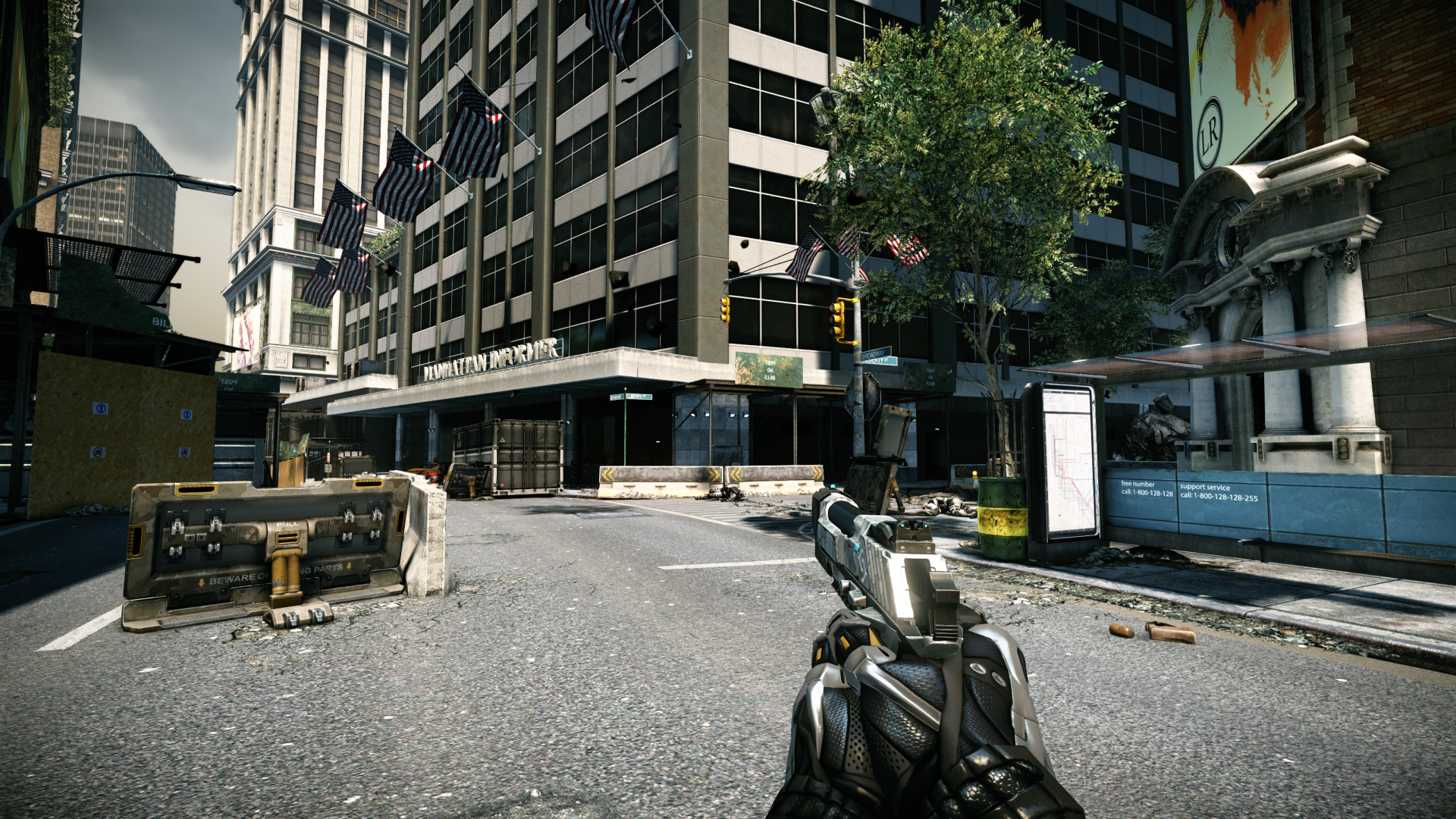 HD desktop wallpaper and background from Crysis 2 featuring a first-person view of a devastated urban landscape with American flags and military equipment.