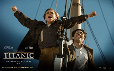 HD desktop wallpaper featuring Leonardo DiCaprio in the famous I'm the king of the world! scene from the movie Titanic, with a clear blue sky in the background.